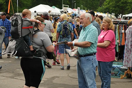 A crowd of people the Shoppes at MerleFest